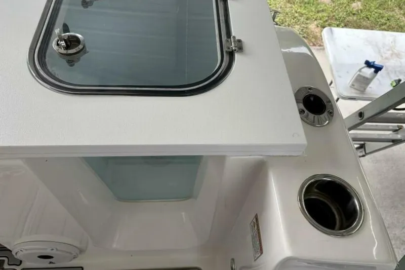 Slide: The Image of 2021 Sea Fox 288 Commander boat detail with storage compartment and cup holders. - 10