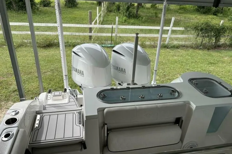 Slide: The Image of 2021 Sea Fox 288 Commander boat with dual Yamaha engines, outdoor setting. - 11