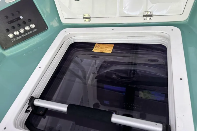 Slide: The Image of 2021 Sea Fox 288 Commander boat hatch and control panel detail. - 16