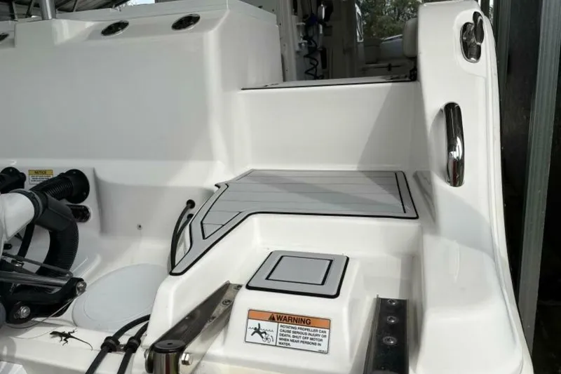 Slide: The Image of 2021 Sea Fox 288 Commander boat deck with warning label and sleek design. - 18