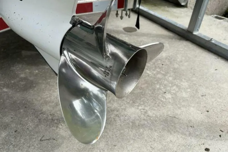 Slide: The Image of Close-up of a 2021 Sea Fox 288 Commander boat propeller on concrete surface. - 21