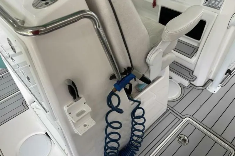 Slide: The Image of 2021 Sea Fox 288 Commander boat interior with seating and coiled blue hose. - 28