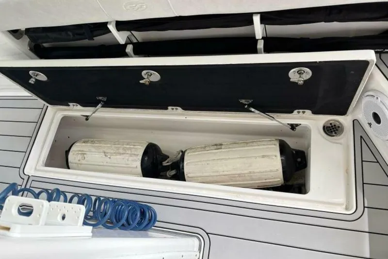 Slide: The Image of Storage compartment on a 2021 Sea Fox 288 Commander boat with fenders inside. - 30