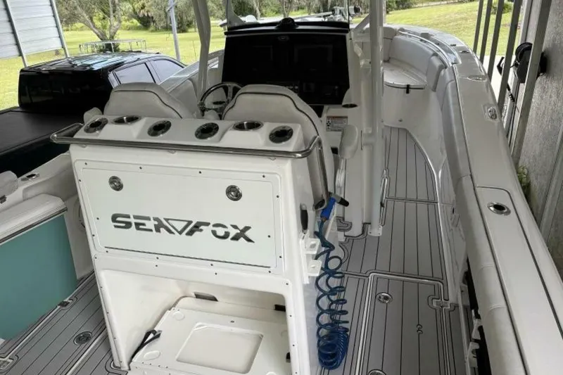 Slide: The Image of 2021 Sea Fox 288 Commander boat interior with seating and control panel. - 32