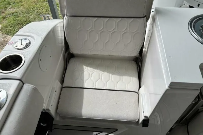 Slide: The Image of 2021 Sea Fox 288 Commander boat seat with textured upholstery and cup holder. - 38