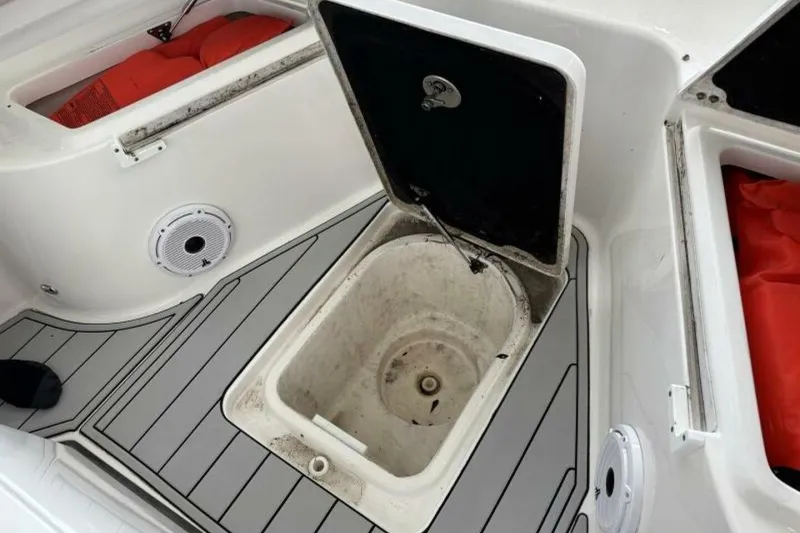 Slide: The Image of 2021 Sea Fox 288 Commander boat deck with open storage compartment and safety equipment. - 42