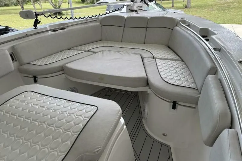 Slide: The Image of 2021 Sea Fox 288 Commander boat interior with cushioned seating and modern design. - 46