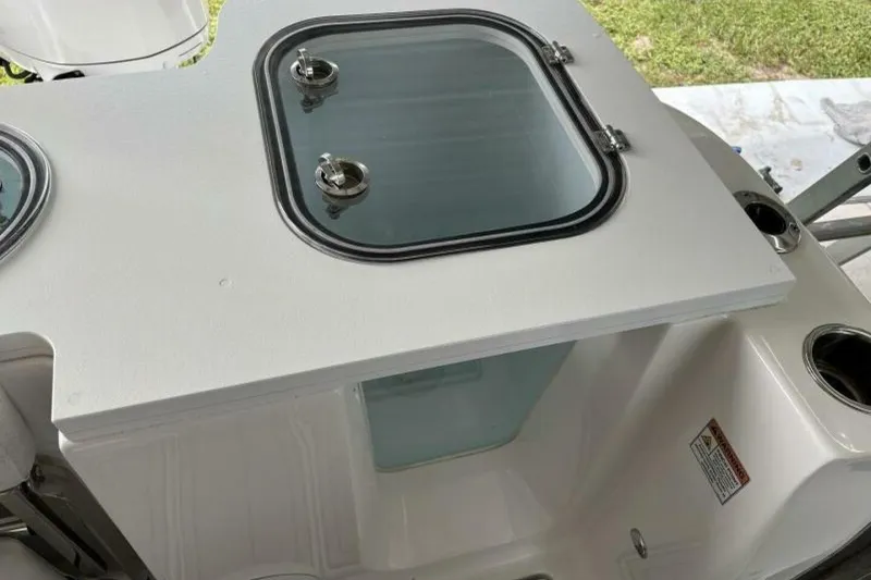 Slide: The Image of 2021 Sea Fox 288 Commander boat with a closed hatch and visible storage compartment. - 48