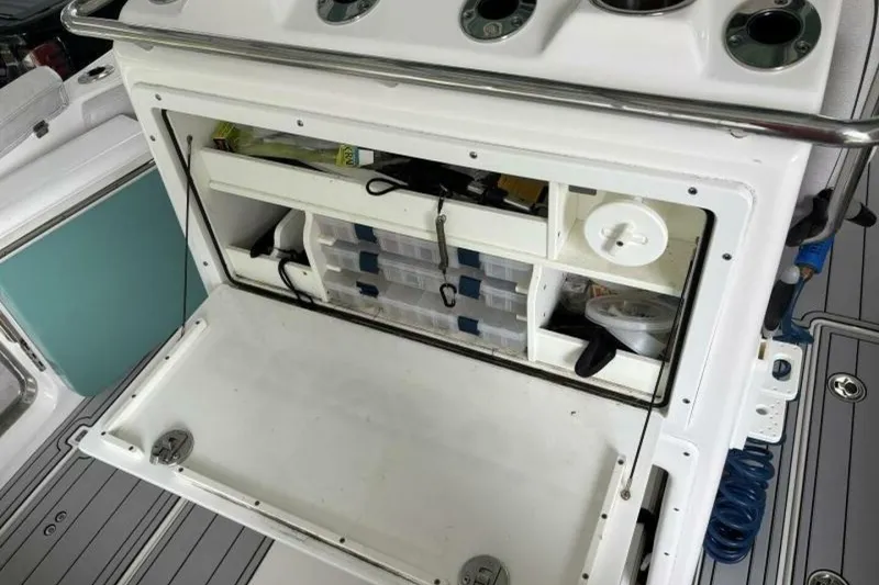 Slide: The Image of 2021 Sea Fox 288 Commander boat storage compartment with organized fishing gear and accessories. - 49