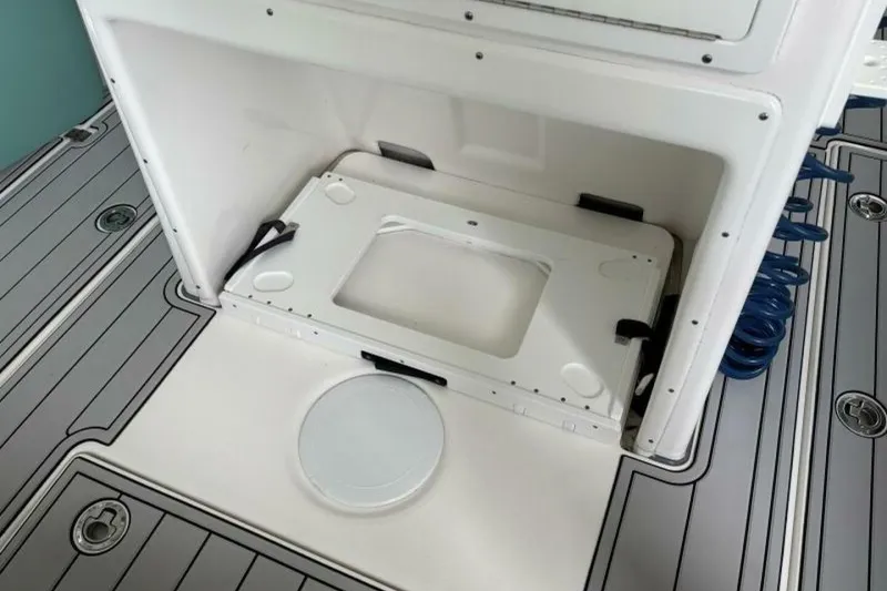 Slide: The Image of 2021 Sea Fox 288 Commander boat interior with storage compartment and deck details. - 51
