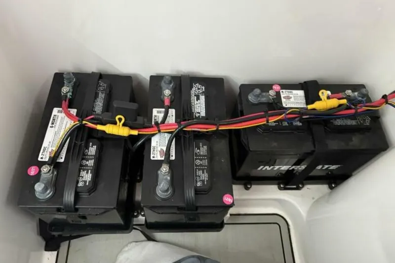 Slide: The Image of Batteries installed in a 2021 Sea Fox 288 Commander boat, connected with colored cables. - 68