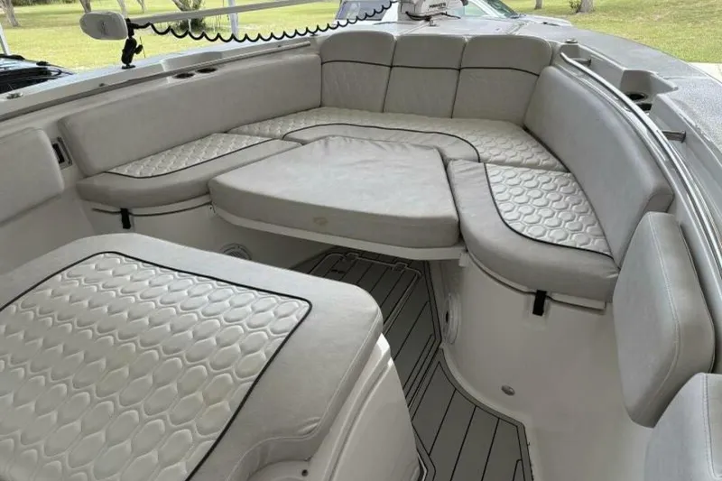 Slide: The Image of 2021 Sea Fox 288 Commander boat interior with cushioned seating and modern design. - 7