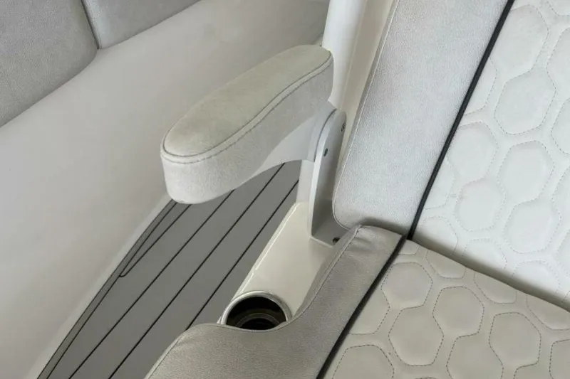 Slide: The Image of 2021 Sea Fox 288 Commander boat interior with cushioned seating and armrest. - 72
