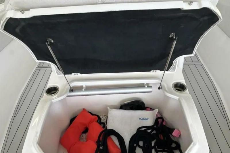 Slide: The Image of Open storage compartment on 2021 Sea Fox 288 Commander boat with life jackets and gear. - 73