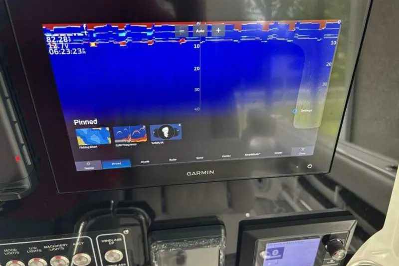 Slide: The Image of Garmin marine display on 2021 Sea Fox 288 Commander, showing sonar and navigation data. - 80