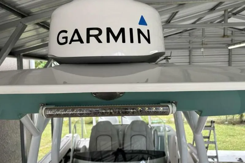 Slide: The Image of 2021 Sea Fox 288 Commander with Garmin radar under a metal shelter. - 81