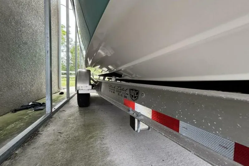Slide: The Image of 2021 Sea Fox 288 Commander boat on trailer, parked in a covered area. - 84