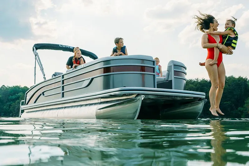 Slide: The Image of Manufacturer Provided Image: Family enjoying a day on a 2025 Lowe SS 250 WT pontoon boat. - 10