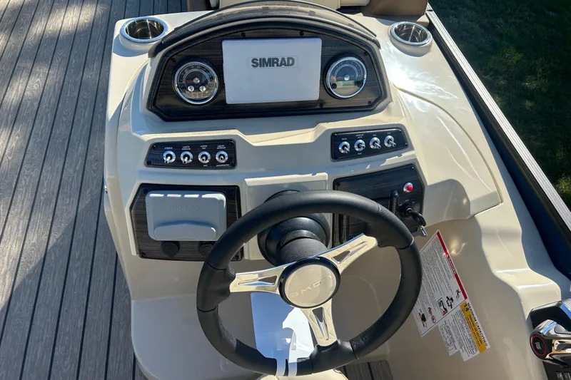 Slide: The Image of Steering console of 2025 Lowe SS 250 WT boat with Simrad display and controls. - 5