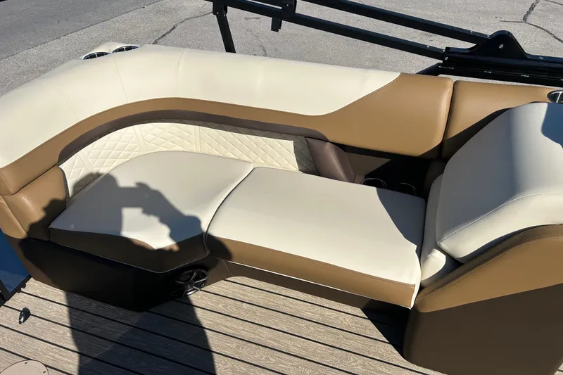 Slide: The Image of Luxurious seating on 2025 Lowe SS 250 WT boat, featuring beige and brown upholstery. - 8
