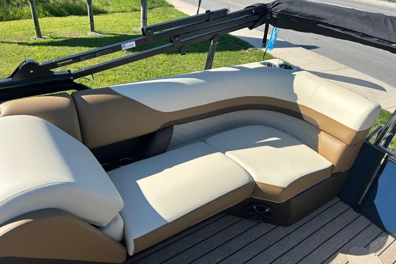 Slide: The Image of Luxurious seating on 2025 Lowe SS 250 WT boat, featuring beige and brown upholstery. - 9
