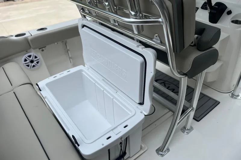 Slide: The Image of Open cooler on 2026 Key West 189 FS boat, showcasing seating and storage features. - 11