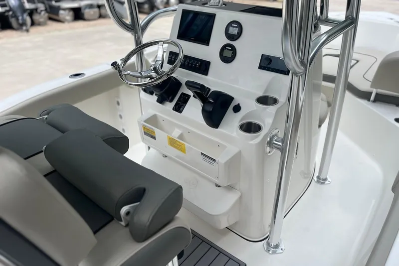 Slide: The Image of 2026 Key West 189 FS boat console with steering wheel and controls. - 12