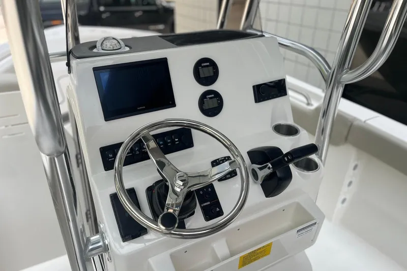 Slide: The Image of Steering console of 2026 Key West 189 FS boat with modern controls and gauges. - 13