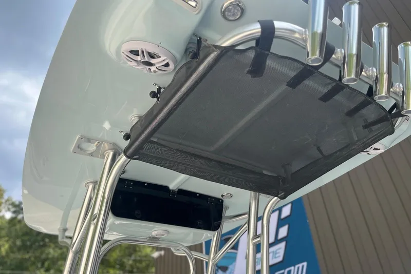 Slide: The Image of T-top of 2026 Key West 189 FS boat with rod holders and speakers. - 16