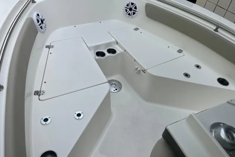 Slide: The Image of 2026 Key West 189 FS boat interior with storage compartments and cup holders. - 18