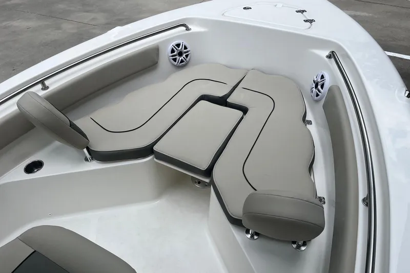 Slide: The Image of 2026 Key West 189 FS boat interior with cushioned seating and speakers. - 7