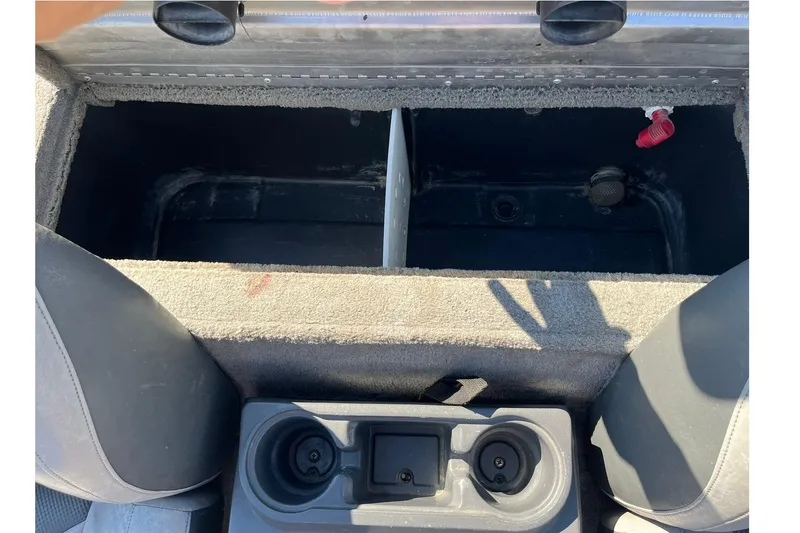 Slide: The Image of 2008 Tracker Pro Team 175 TXW boat storage compartment with cup holders and seating. - 17