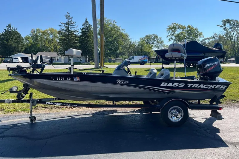 Slide: The Image of 2008 Tracker Pro Team 175 TXW bass boat on trailer, parked outdoors. - 3