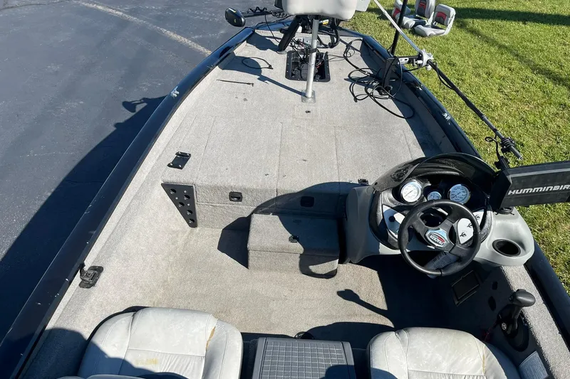 Slide: The Image of 2008 Tracker Pro Team 175 TXW boat interior with steering wheel and fishing equipment. - 6