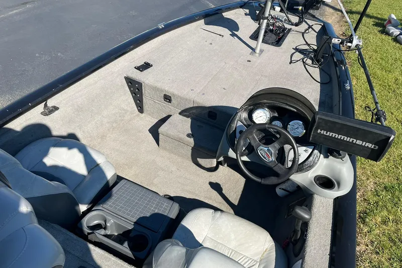 Slide: The Image of 2008 Tracker Pro Team 175 TXW boat interior with steering wheel and Humminbird fish finder. - 8