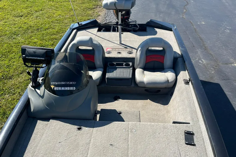 Slide: The Image of 2008 Tracker Pro Team 175 TXW boat interior with seats and Humminbird equipment. - 9