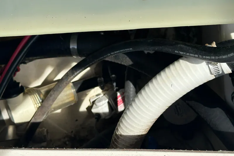 Slide: The Image of Engine compartment of 2012 Blackwood 270 with visible hoses and components. - 18