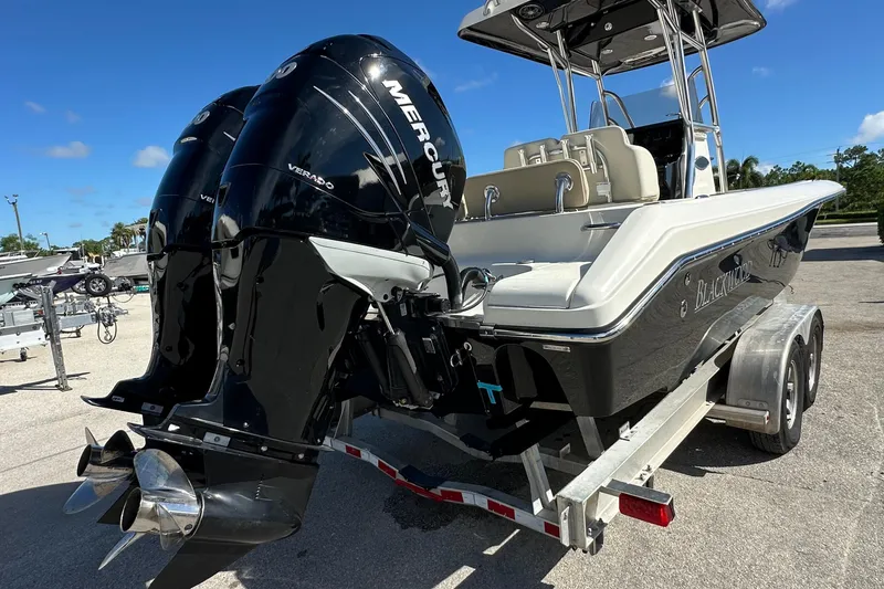 Slide: The Image of 2012 Blackwood 270 boat with dual Mercury Verado engines on a trailer. - 3