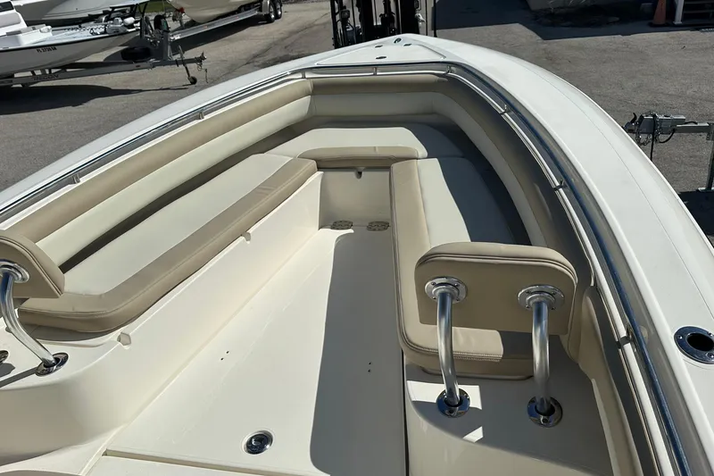 Slide: The Image of 2012 Blackwood 270 boat interior with beige seating and stainless steel fixtures. - 7