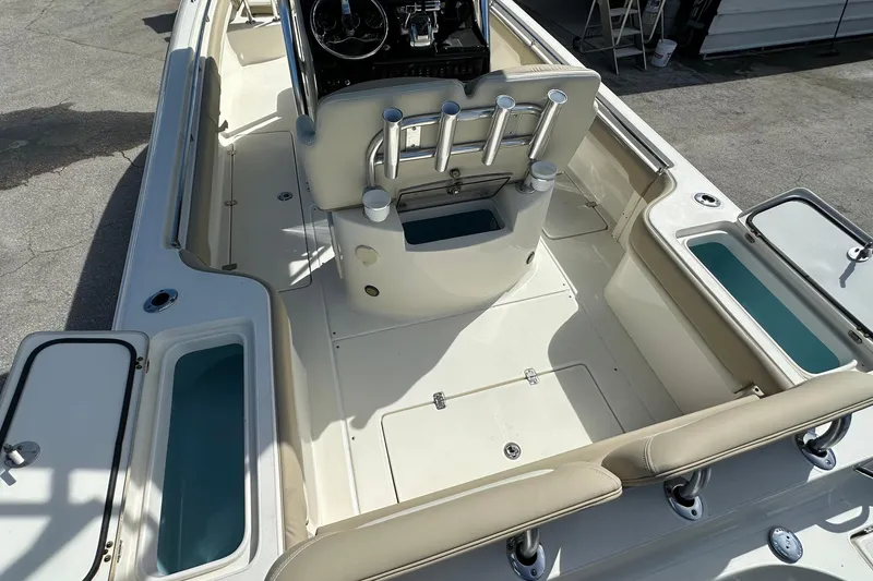 Slide: The Image of 2012 Blackwood 270 boat interior with seating, storage compartments, and steering console. - 8