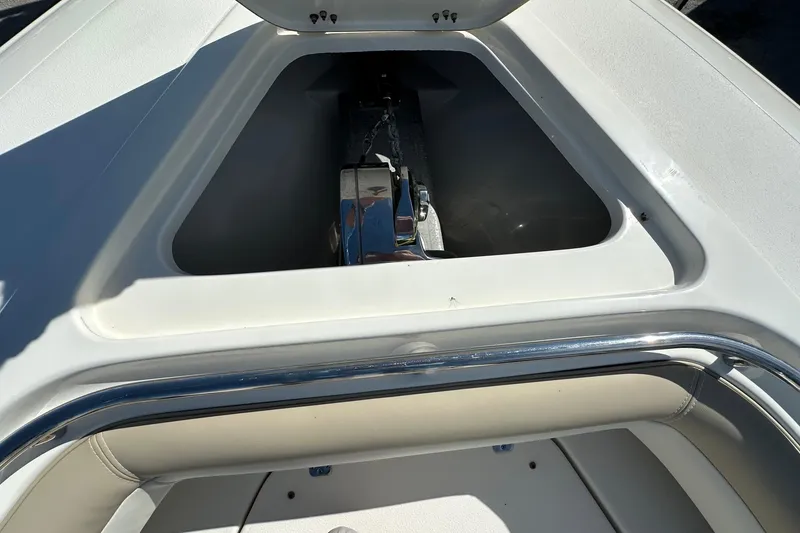 Slide: The Image of Anchor compartment of 2012 Blackwood 270 boat, featuring sleek design and chrome details. - 9