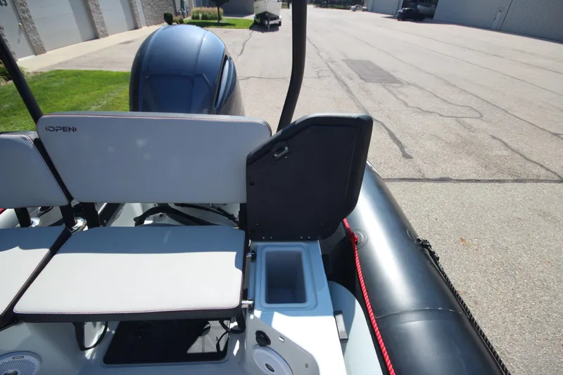 Slide: The Image of 2018 Zodiac Open 7 NEO boat with trailer, rear seating and storage view. - 10
