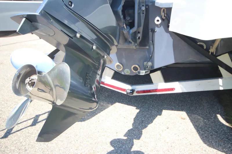 Slide: The Image of 2018 Zodiac Open 7 NEO boat with trailer, featuring a shiny propeller. - 24