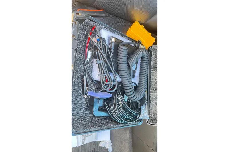 Slide: The Image of Coiled cables and tools in a case for 2018 Zodiac Open 7 NEO w/ Trailer. - 30