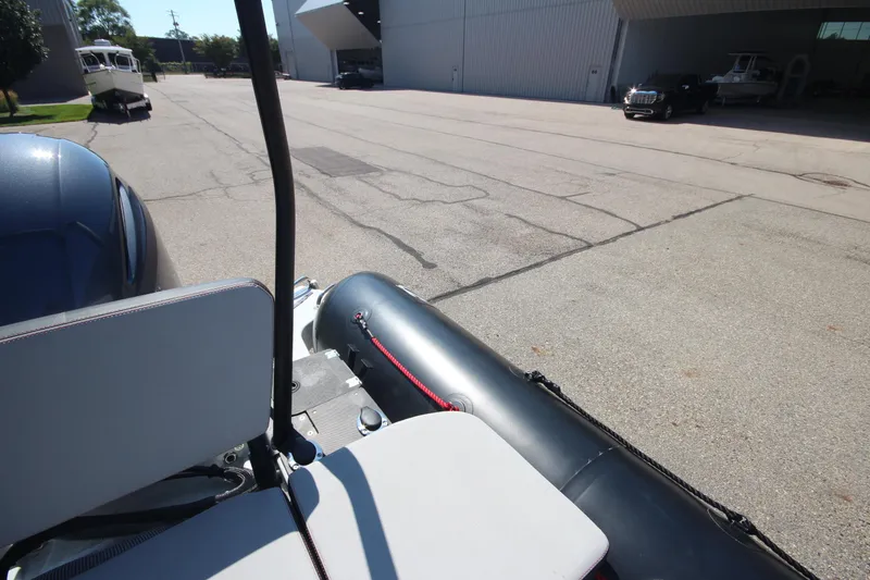 Slide: The Image of 2018 Zodiac Open 7 NEO boat on trailer in parking lot. - 9