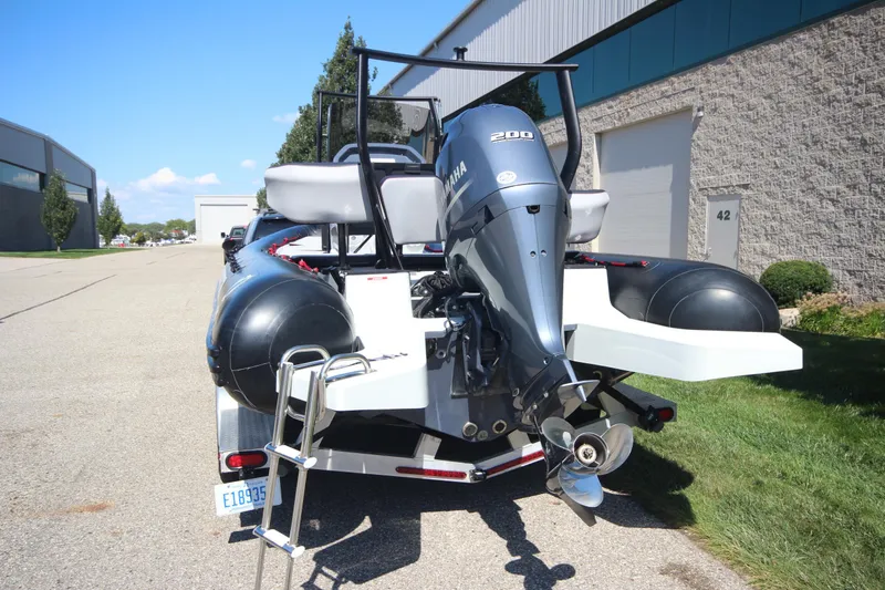 Slide: The Image of 2018 Zodiac Open 7 NEO boat with trailer, featuring a Yamaha 200 engine. - 25