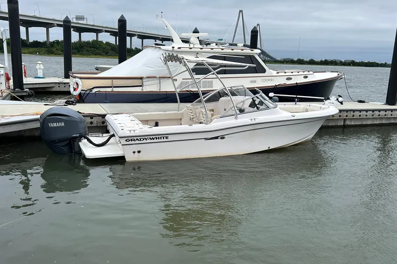 Slide: The Image of 2011 Grady-White Freedom 225 boat docked with Yamaha outboard motor. - 1