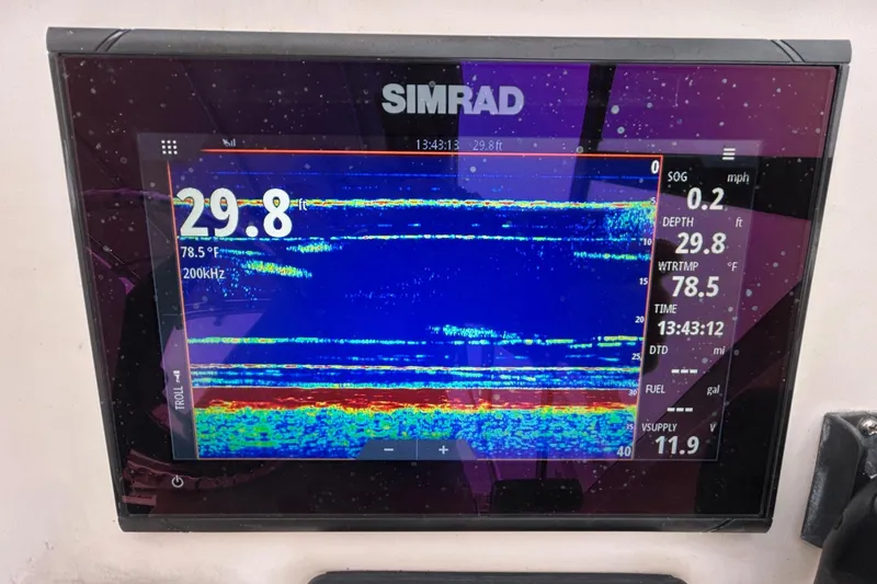 Slide: The Image of Simrad marine display showing sonar data on a 2011 Grady-White Freedom 225 boat. - 12