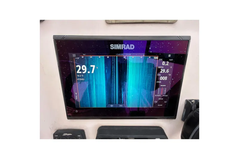 Slide: The Image of Simrad marine display on 2011 Grady-White Freedom 225, showing depth and temperature readings. - 13