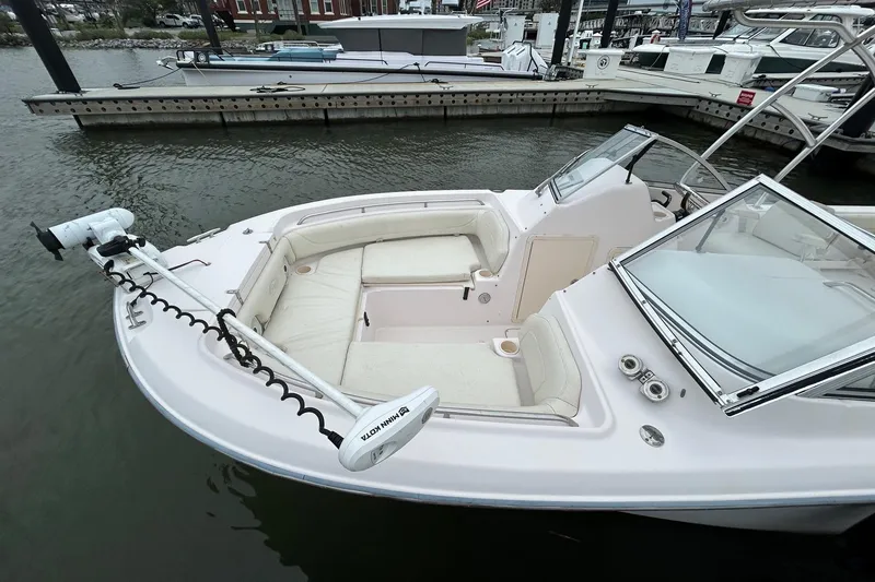 Slide: The Image of 2011 Grady-White Freedom 225 boat with seating, docked at marina. - 5